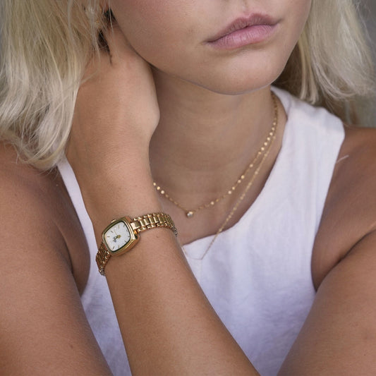 Aurora · Reloj de Mujer Dorado con Detalle de Perla