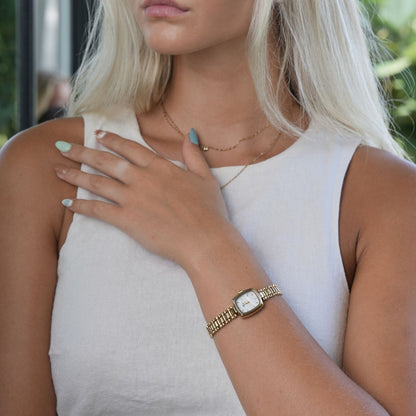 Aurora · Reloj de Mujer Dorado con Detalle de Perla