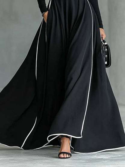 Gina | Vestido maxi negro con costuras blancas y cuello alto